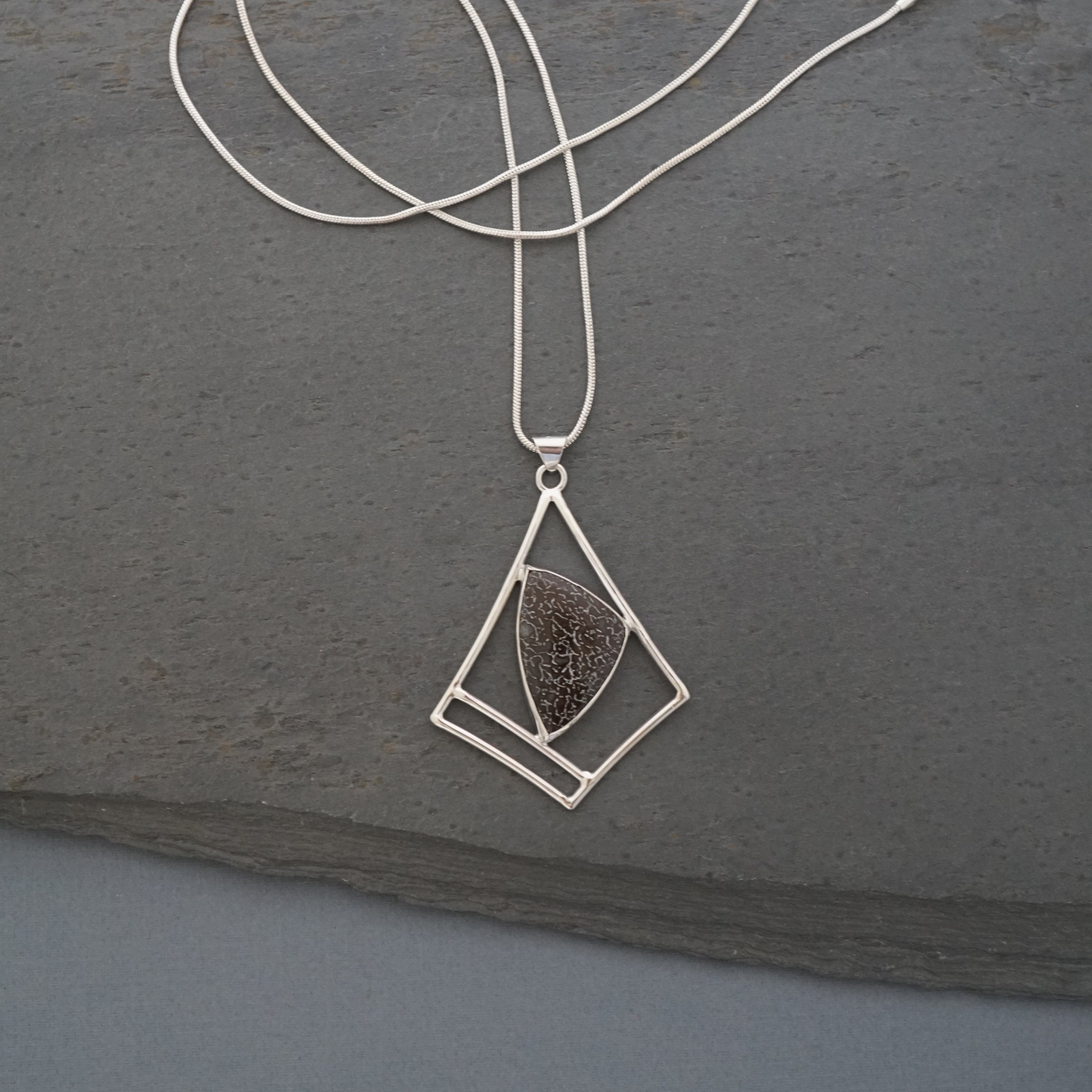 "Dino Bone" Pendant, Sterling silver and fossilized bone